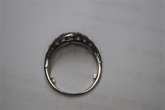 A white metal and diamond cluster set elliptical shaped ring, size H/I.